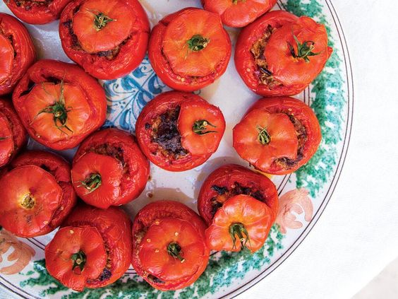 Tomatoes stuffed with foie gras, duck confit and chanterelles